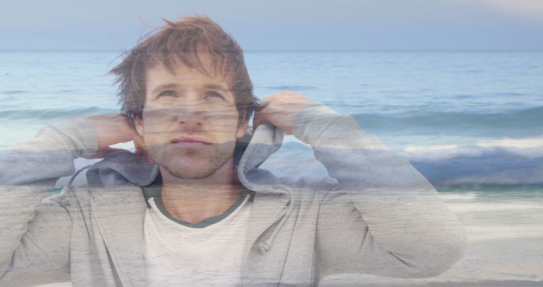 Man Reflective at Beach with Casual Attire
