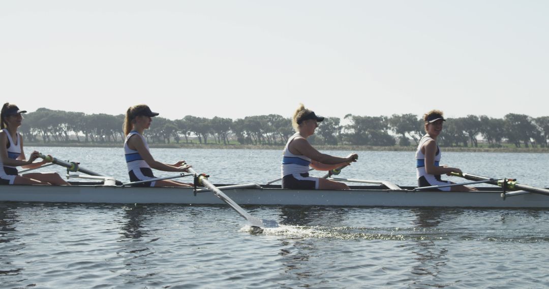 Women's Rowing Team Training on Calm Lake in Sunny Weather - Free Images, Stock Photos and Pictures on Pikwizard.com