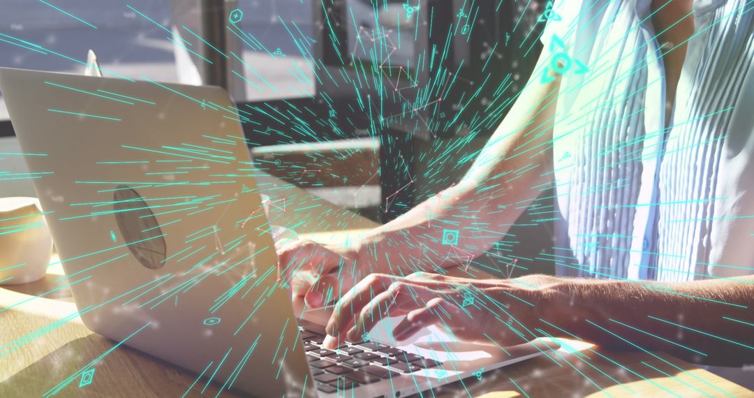 Woman Working on Laptop with Vibrant Digital Overlay in Bright Workspace