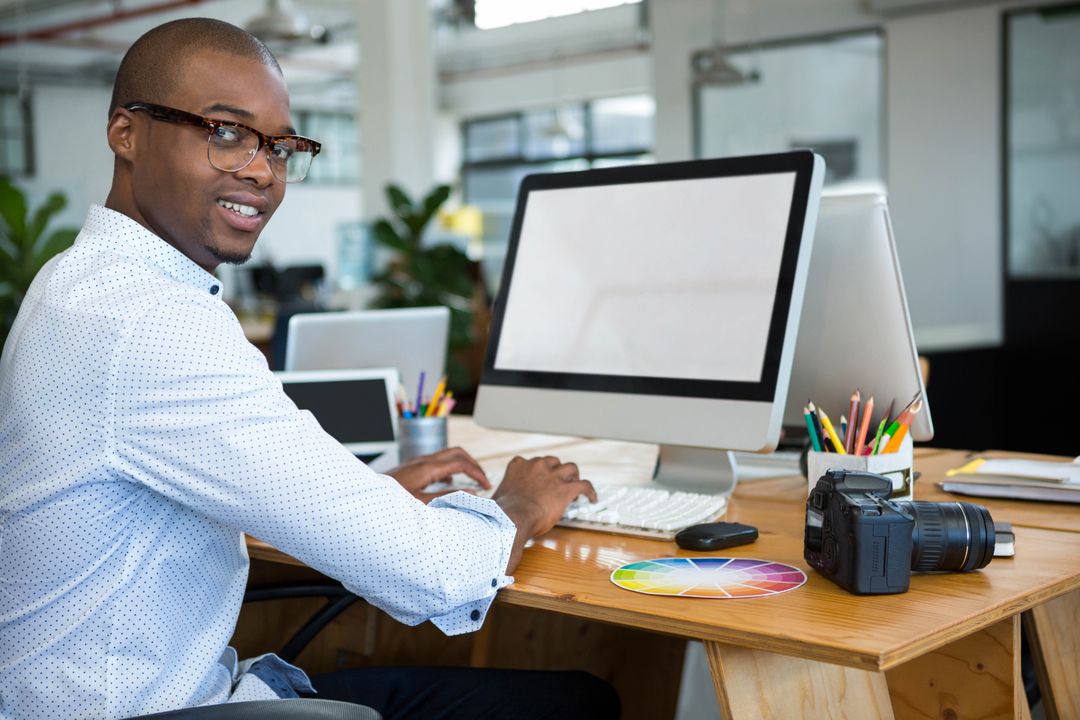 Creative Designer Using Color Wheel at Modern Workstation