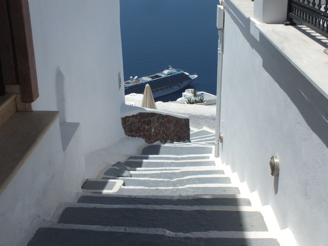 White Stone Narrow Steps Leading to Sea with Cruise Ship - Free Images, Stock Photos and Pictures on Pikwizard.com