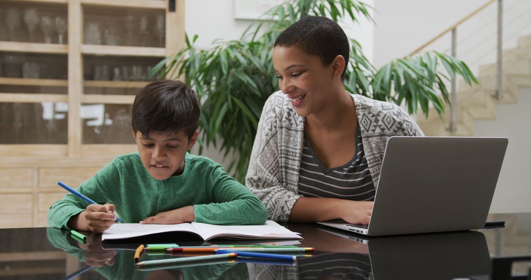 Mother Helping Son with Homework at Living Room Table - Free Images, Stock Photos and Pictures on Pikwizard.com