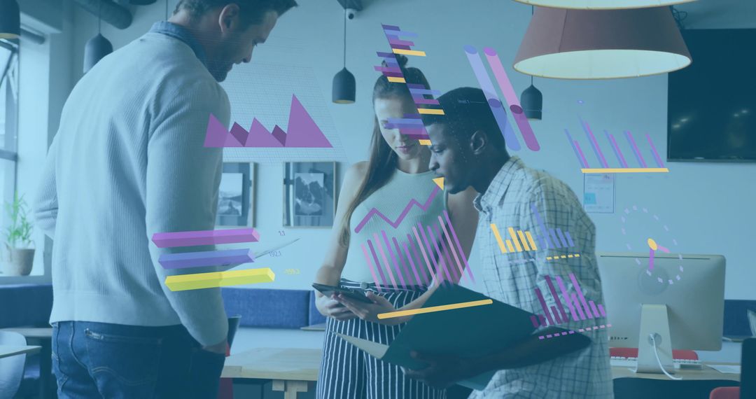 Colleagues Analyzing Data in Modern Office for Strategic Decisions