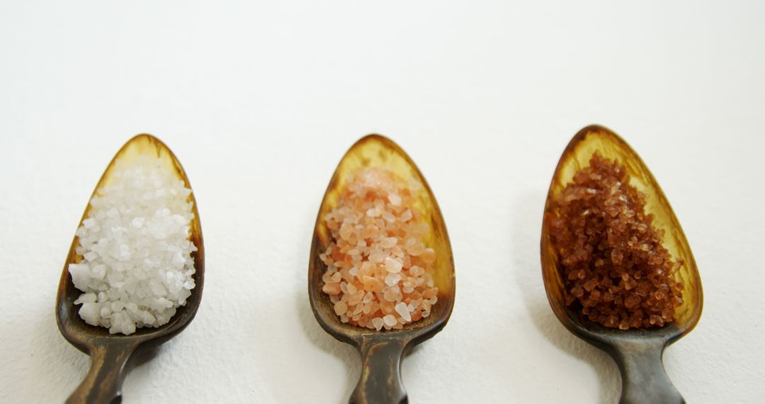 Three Types of Salt in Rustic Spoons on White Background - Free Images, Stock Photos and Pictures on Pikwizard.com