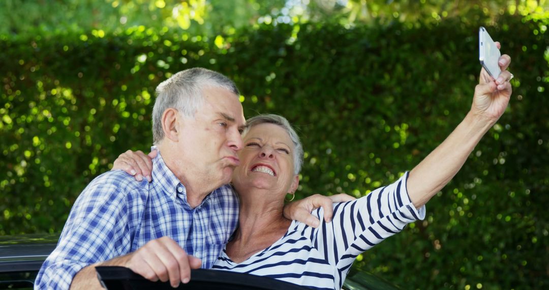 An elderly couple joyfully captures a playful selfie, embodying graceful aging. - Free Images, Stock Photos and Pictures on Pikwizard.com
