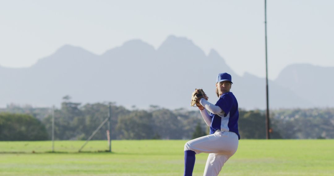 Baseball Player Ready to Pitch on Sunny Day - Free Images, Stock Photos and Pictures on Pikwizard.com