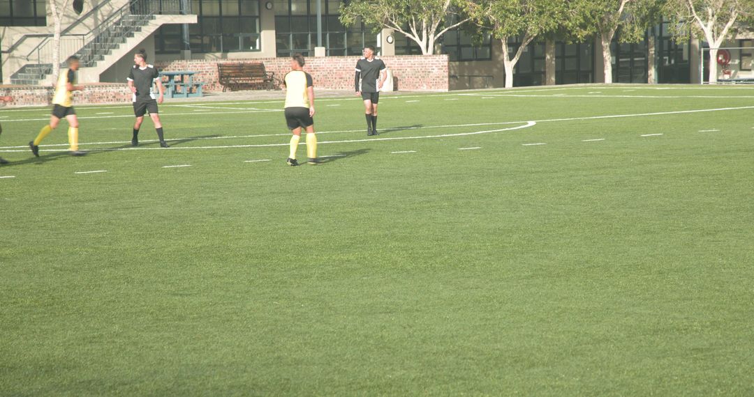 Soccer Players Engaged in Game Highlighting Teamwork and Strategy