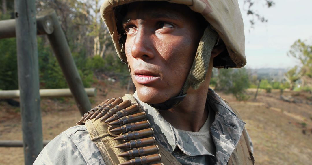 Determined Soldier in Camouflage with Bullet Bandolier in Forest - Free Images, Stock Photos and Pictures on Pikwizard.com