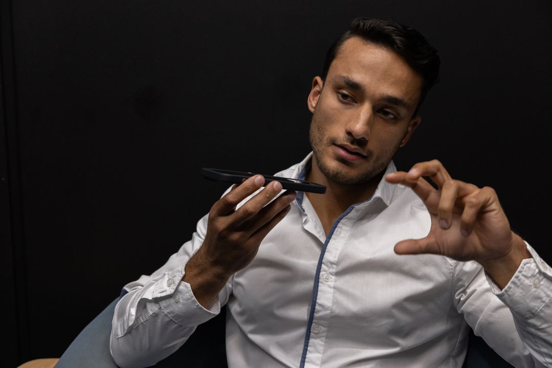 Businessman Engaging in Smartphone Voice Command