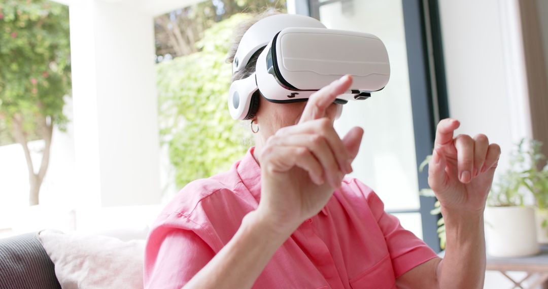 Senior Woman Engaging with Virtual Reality at Home