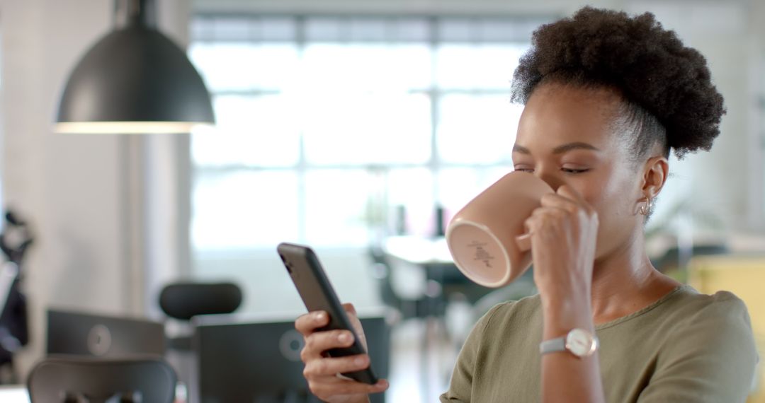 Professional Woman Drinking Coffee While Using Smartphone