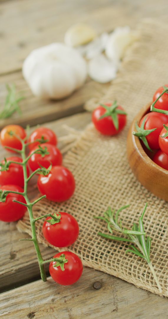 Rustic Display of Fresh Cherry Tomatoes and Garlic