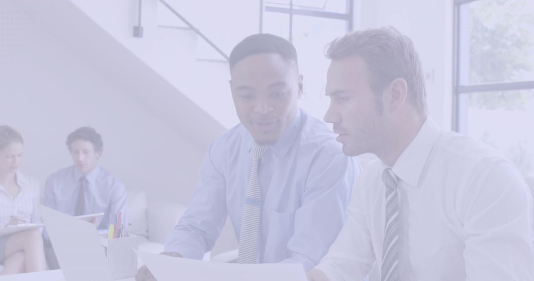 Diverse Businessmen Collaborating at Modern Office