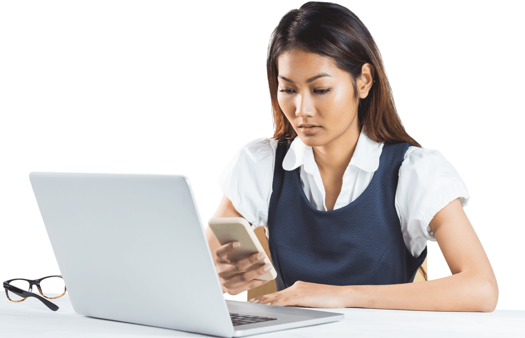 Transparent Image of Focused Businesswoman Using Laptop and Smartphone