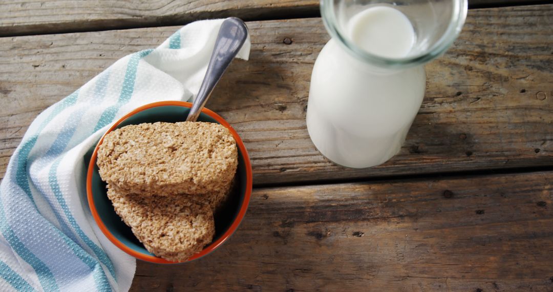 Healthy Muesli Breakfast with Milk on Rustic Wooden Table - Free Images, Stock Photos and Pictures on Pikwizard.com