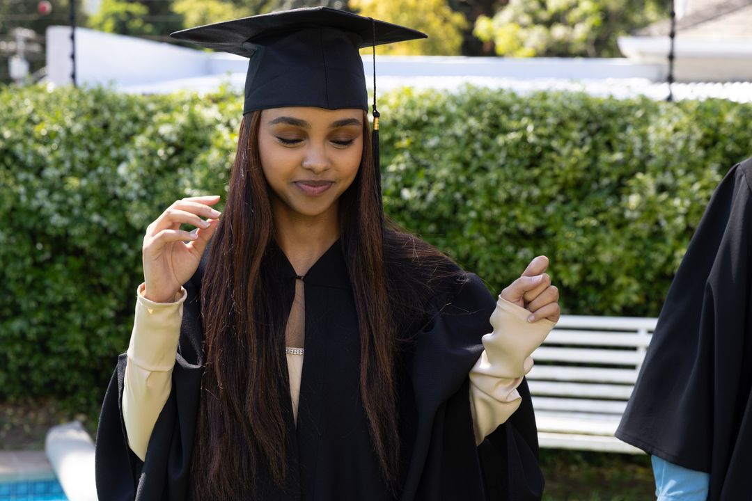 Celebrating Graduation in Outdoor Setting with Elegant Student