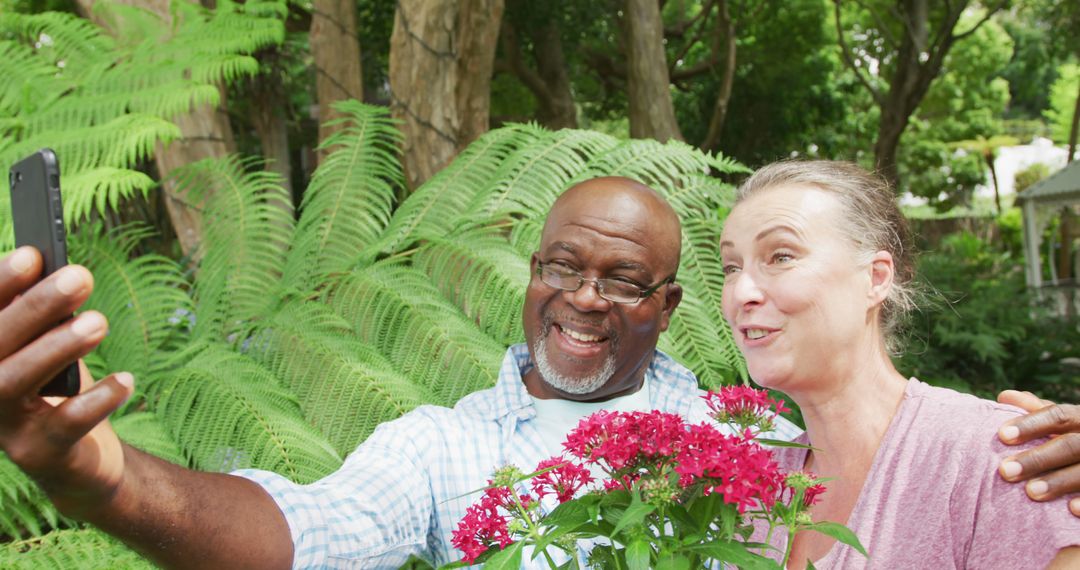 Senior Couple Taking Selfie in Garden with Flowers - Free Images, Stock Photos and Pictures on Pikwizard.com