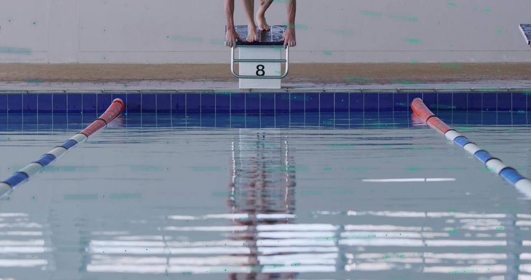 Swimmers Preparing for Dive on Starting Block at Poolside