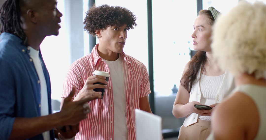 Diverse Team Collaborating Over Coffee for Innovative Solutions