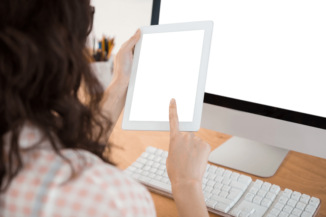 Businesswoman Using Transparent Tablet in Office Workspace