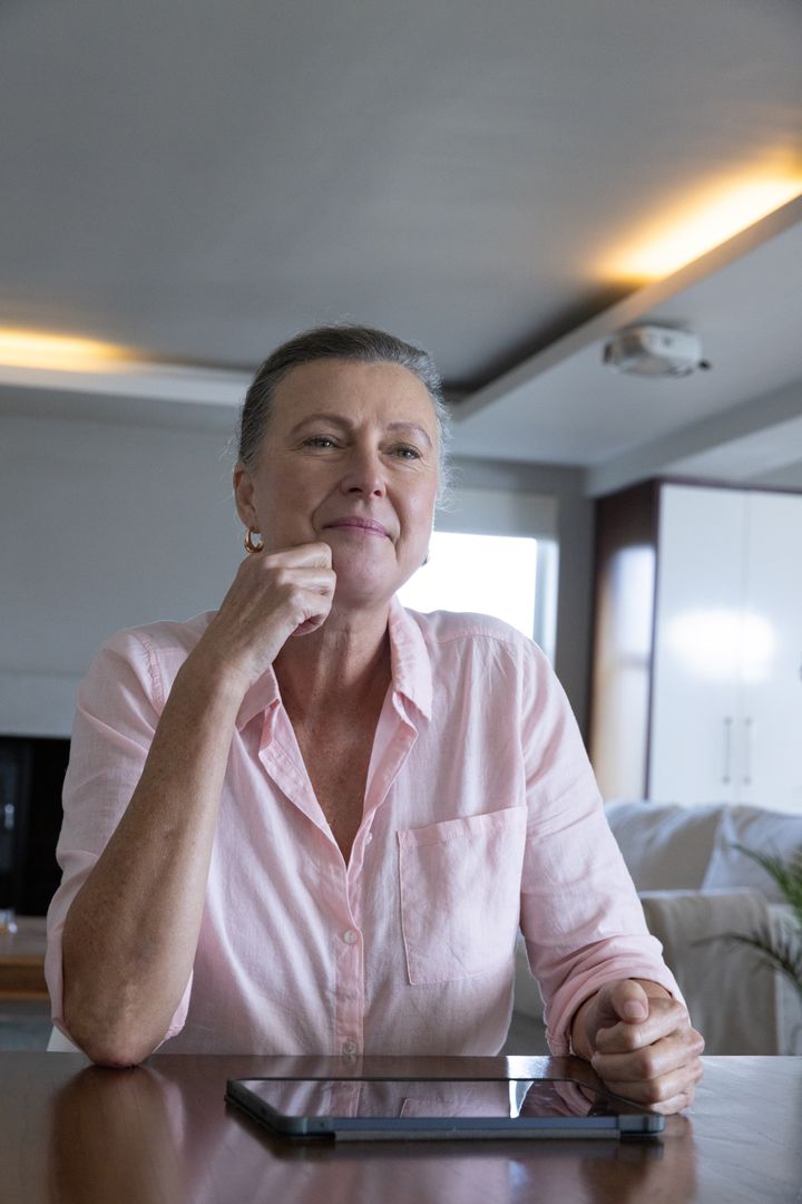 Senior Woman Relaxing with Tablet at Home