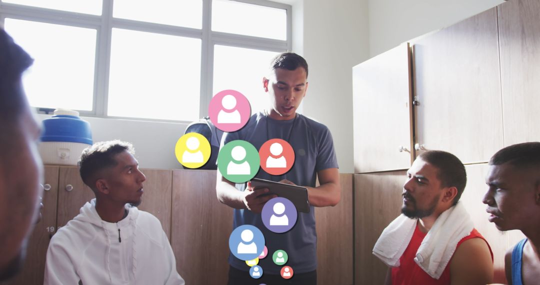 Male Coach Using Technology for Team Strategy Discussion