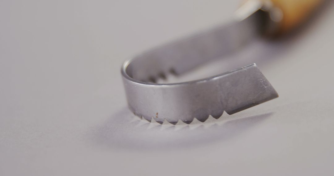 Close-up of a Sharp Metal Blade with Serrated Edge - Free Images, Stock Photos and Pictures on Pikwizard.com