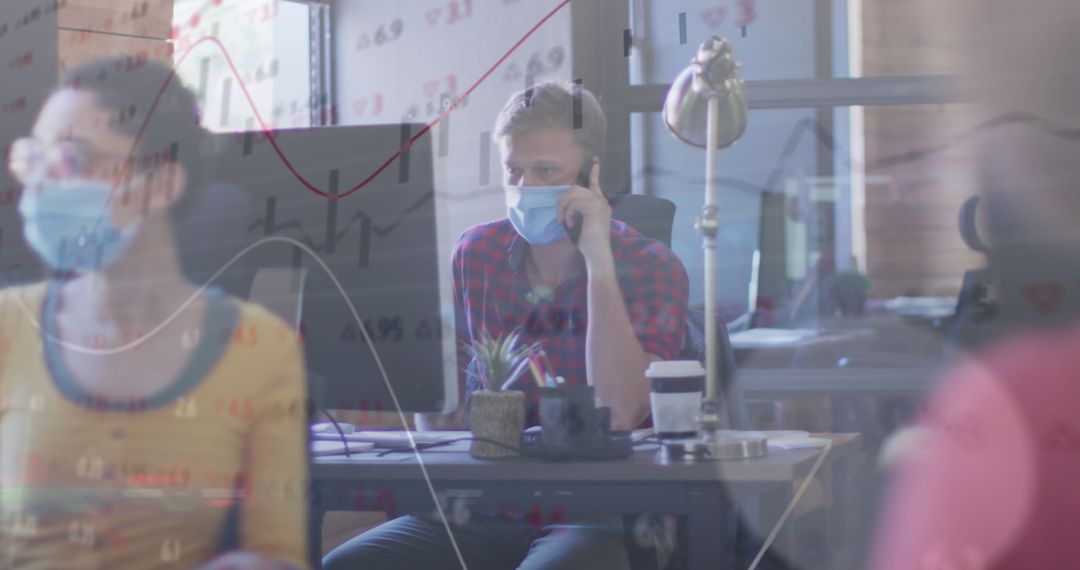 Office Team Working Amidst COVID-19 Pandemic with Data Overlay