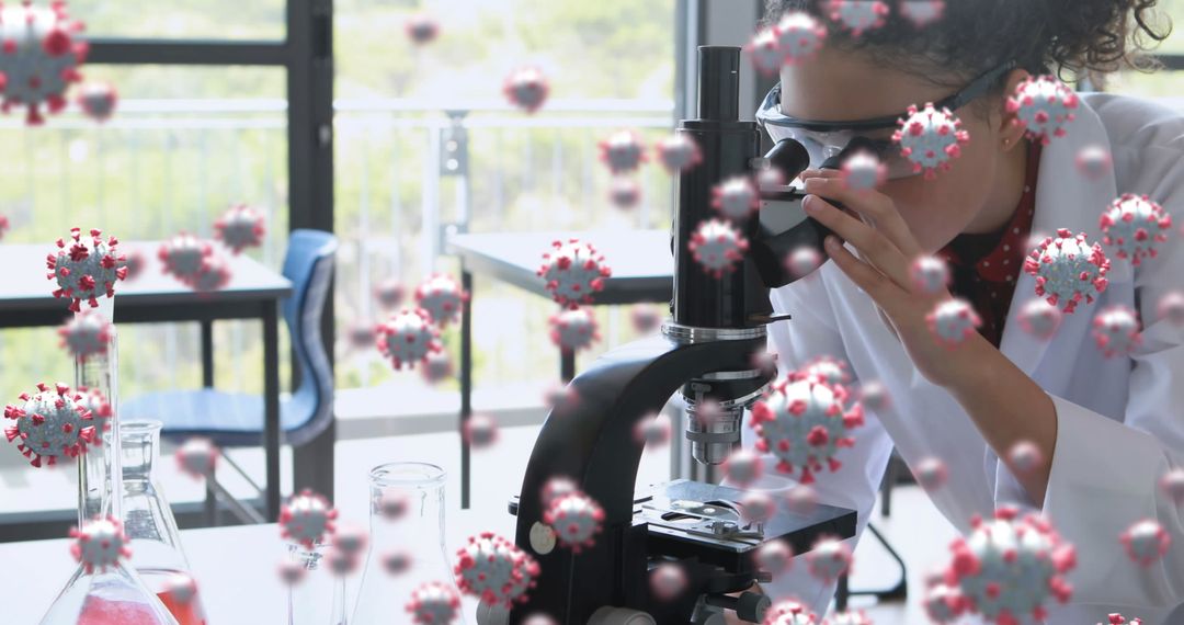 Scientist Examining Coronavirus Cells Using Microscope
