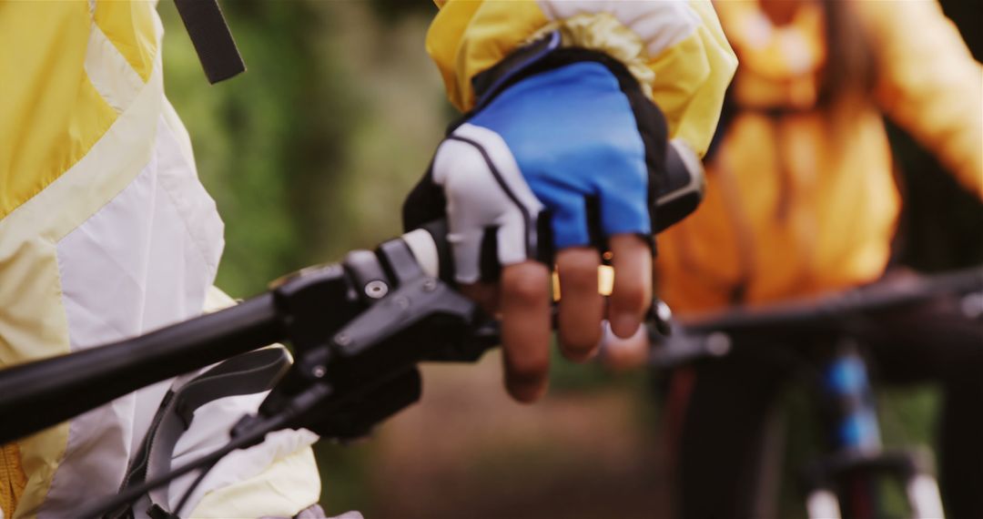 Close-up of Cyclist's Gloved Hand Gripping Handlebars - Free Images, Stock Photos and Pictures on Pikwizard.com