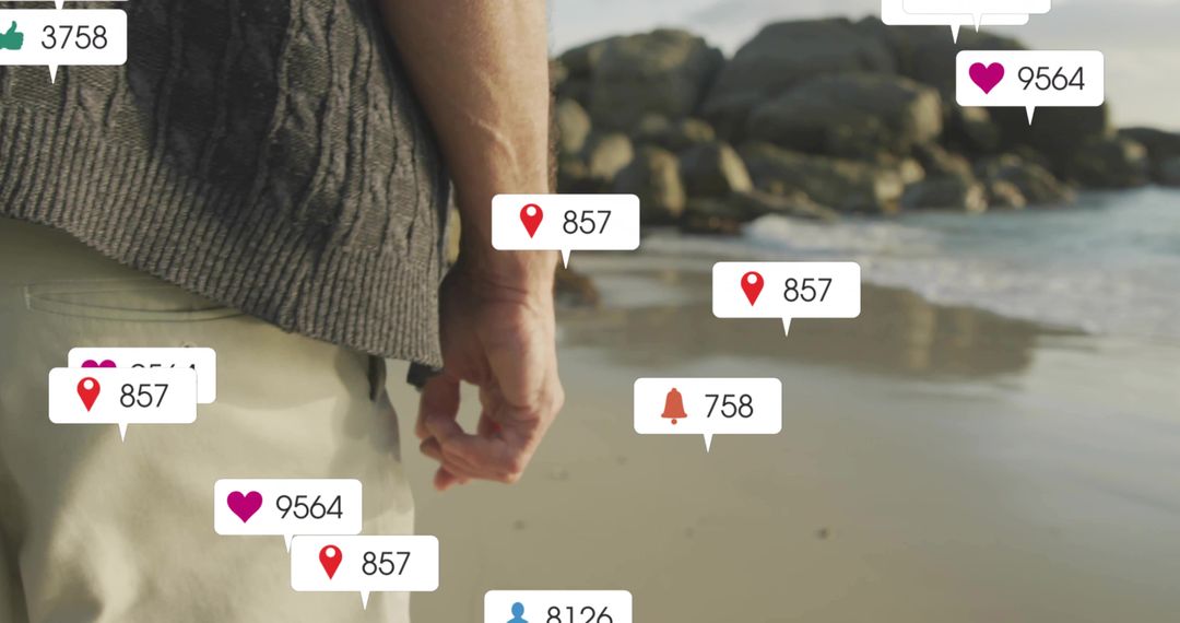 Man Walking on Beach with Digital Social Icons Overlay