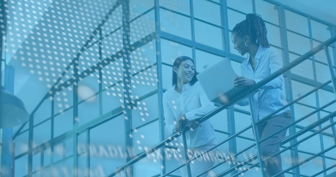 Diverse Team Discussing Financial Data Insights Using Laptop