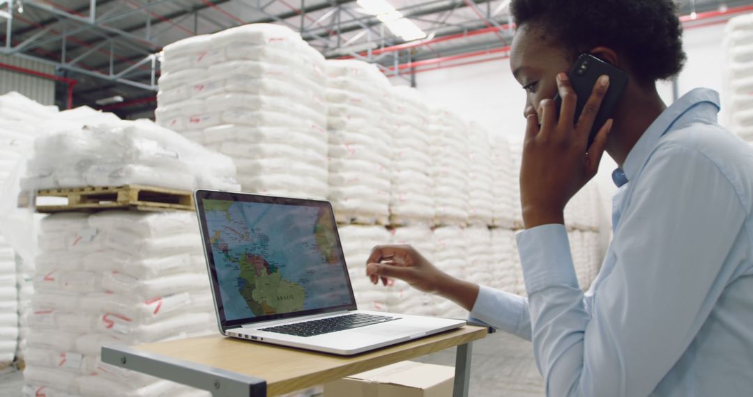 Businesswoman Optimizing Logistics With Laptop in Warehouse - Free Images, Stock Photos and Pictures on Pikwizard.com