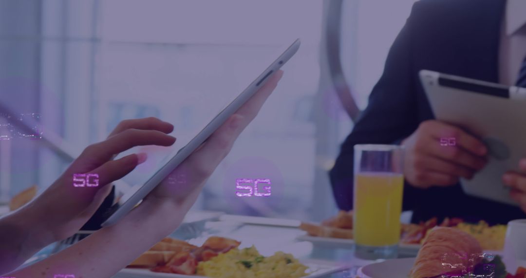 Business Professionals Utilizing Digital Tablets with 5G Technology