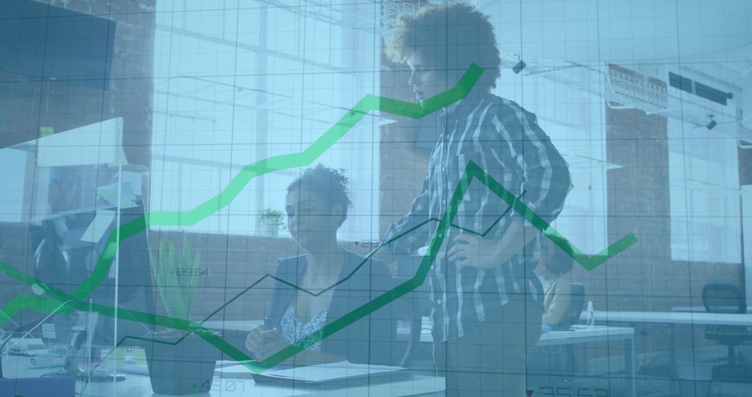 Office Team Evaluating Data Analysis on Computer Screen