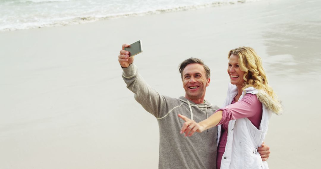 Cheerful Mature Couple Taking Selfie on Beach - Free Images, Stock Photos and Pictures on Pikwizard.com