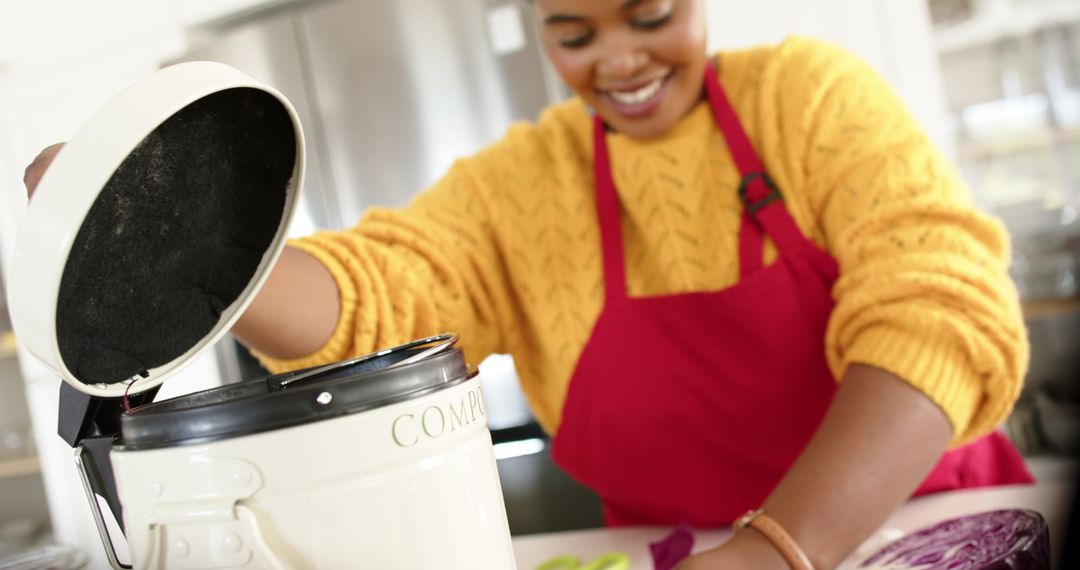 Smiling Woman Composting Food Waste in Kitchen
