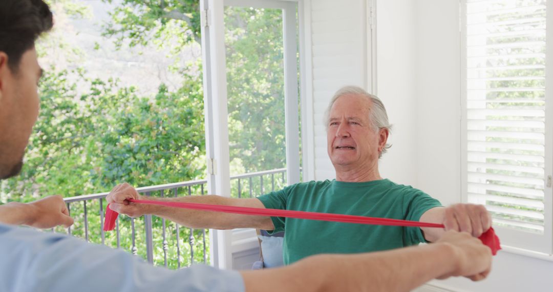 Senior Man Doing Physical Therapy with Resistance Band - Free Images, Stock Photos and Pictures on Pikwizard.com