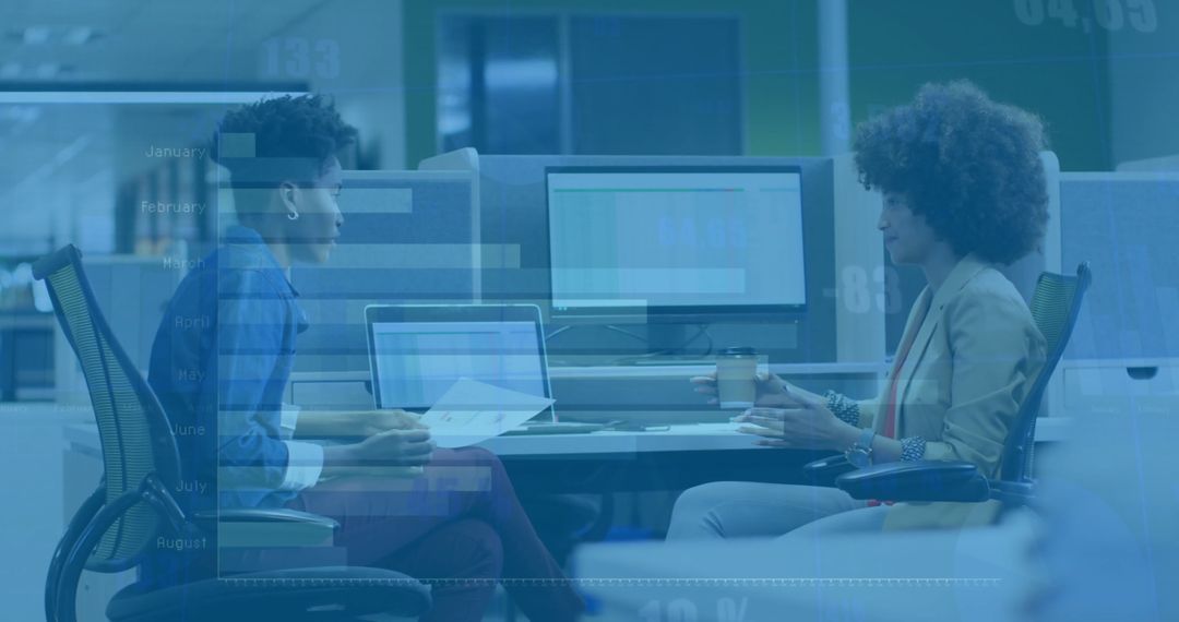 Colleagues Discussing Data Trends with Digital Charts Overlay