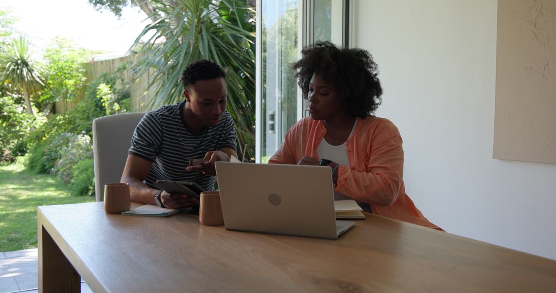 Couple Collaborates at Home with Technology in Natural Setting