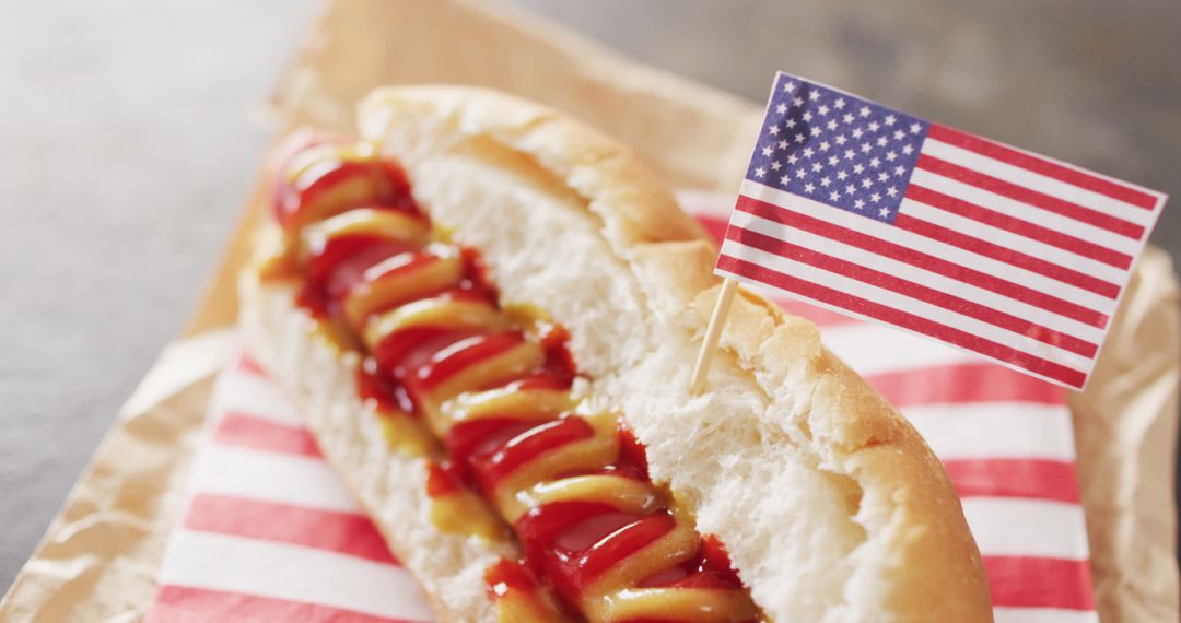 Image of hot dog with mustard and ketchup with flag of usa on a black surface - Free Images, Stock Photos and Pictures on Pikwizard.com