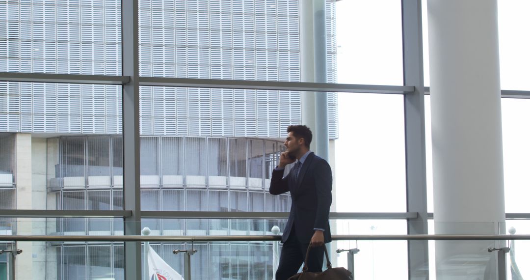 Businessman in Suit Talking on Phone at Modern Office Complex - Free Images, Stock Photos and Pictures on Pikwizard.com