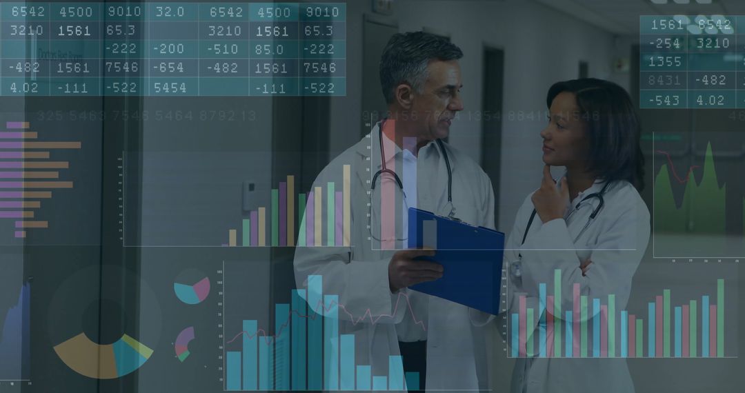 Doctors Collaborating on Data in Hospital Corridor