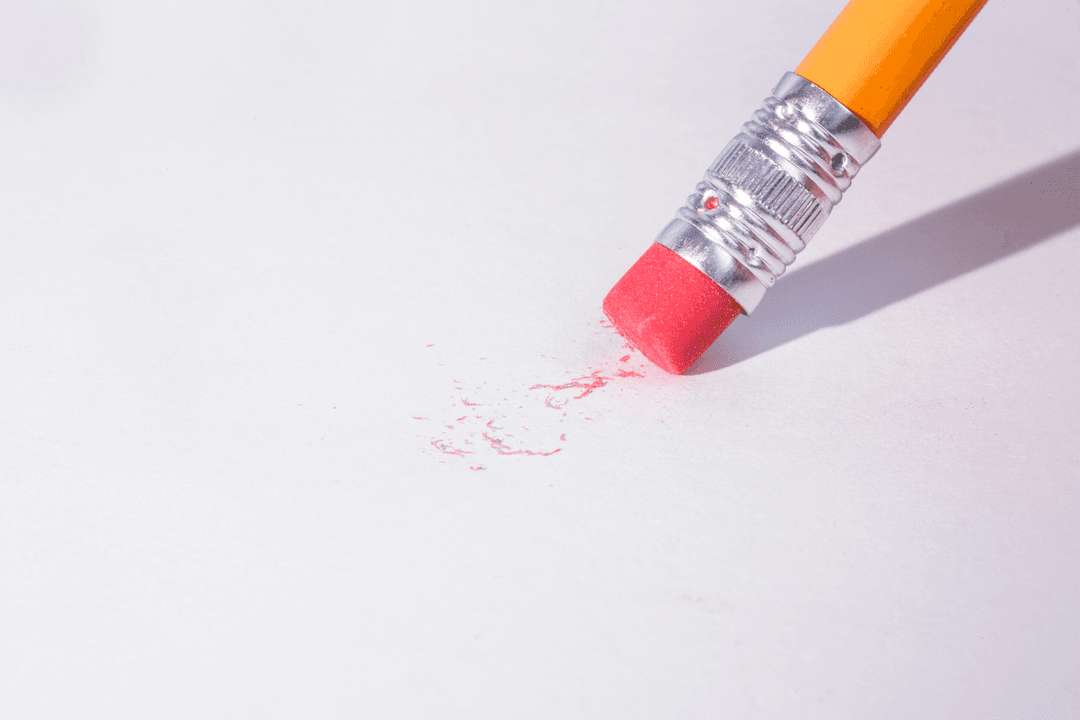 Pencil with Transparent Eraser on White Background in Action