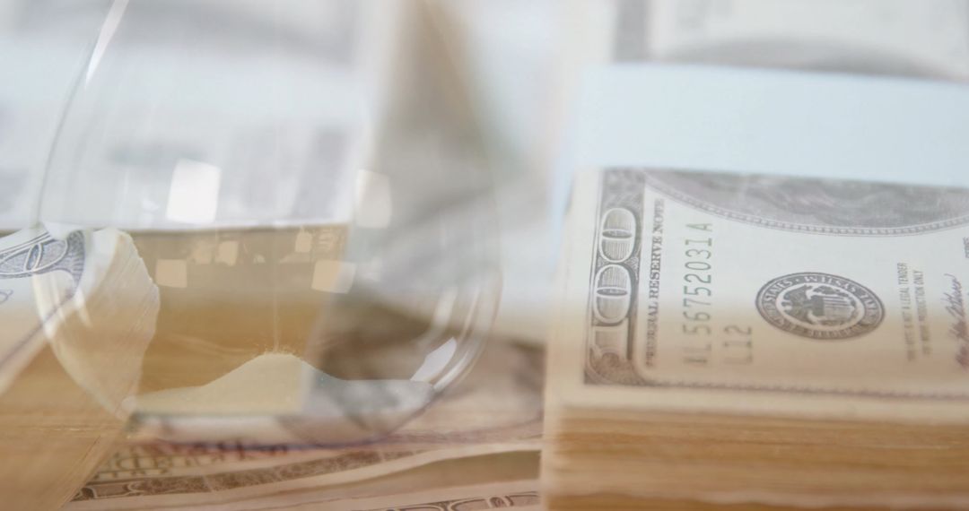 Digital Business Concept with Banknotes and Hourglass Reflection