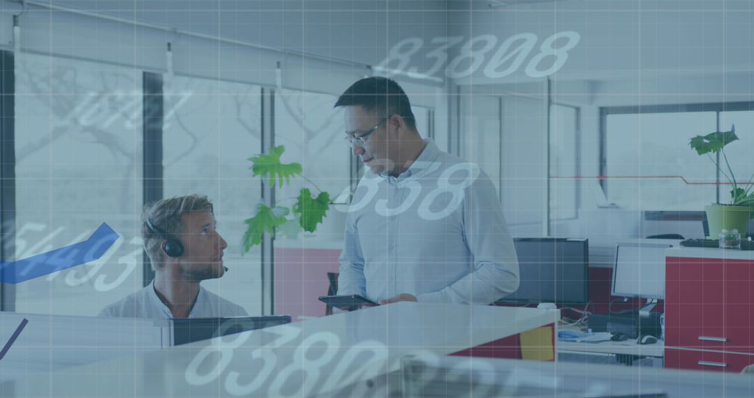 Business Colleagues Engaged with Digital Data in Modern Office Environment