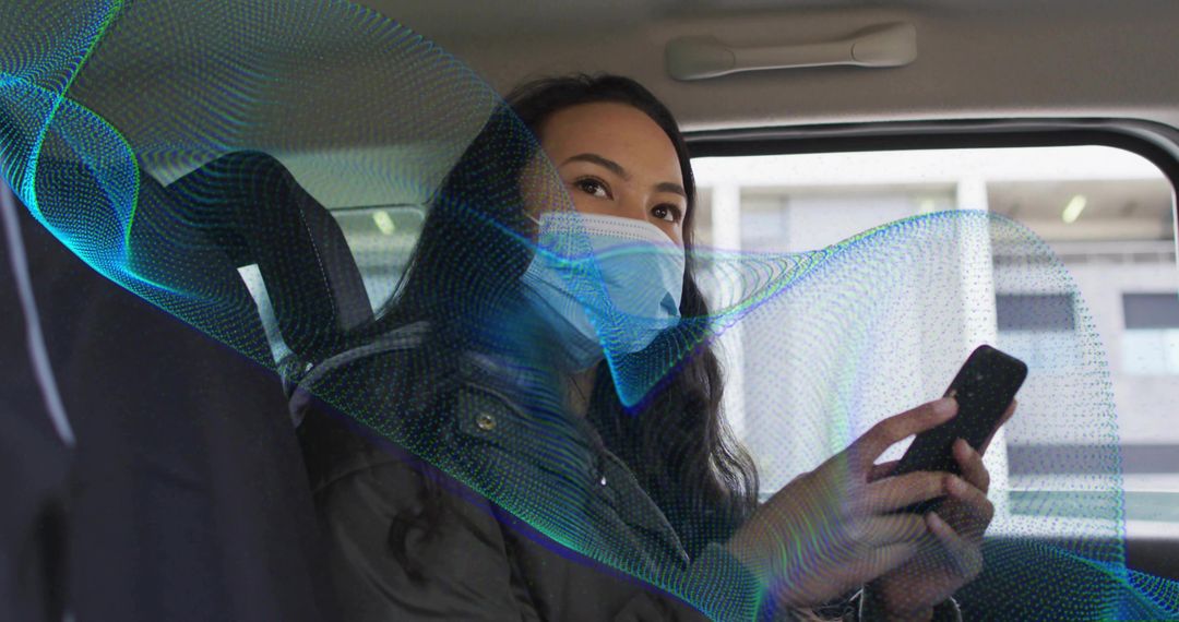 Woman wearing surgical mask using smartphone in taxi backseat with futuristic data wave overlay