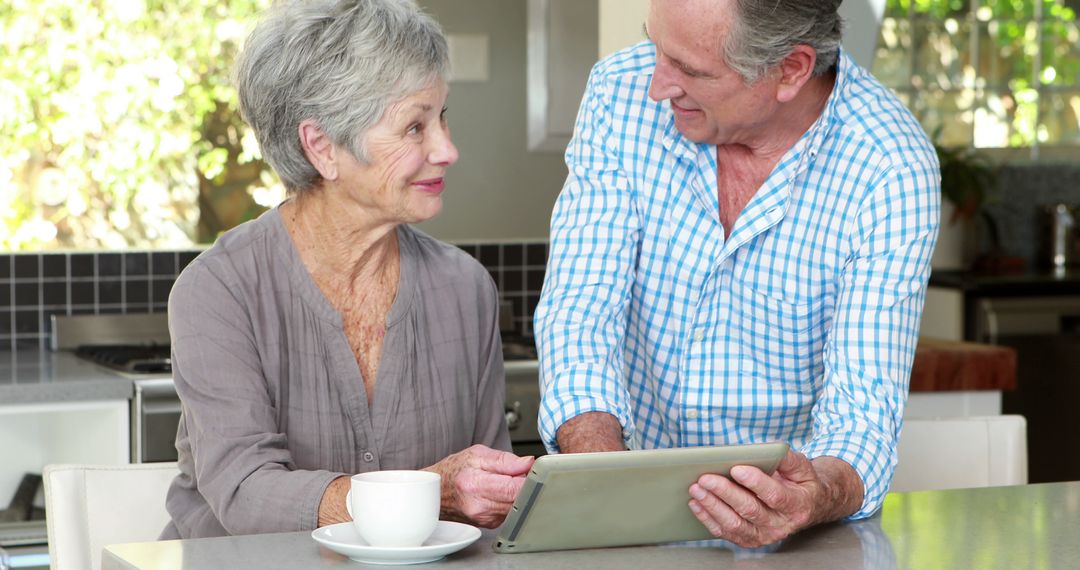 Seniors Enjoying Technology, Elderly Couple Using Tablet - Free Images, Stock Photos and Pictures on Pikwizard.com