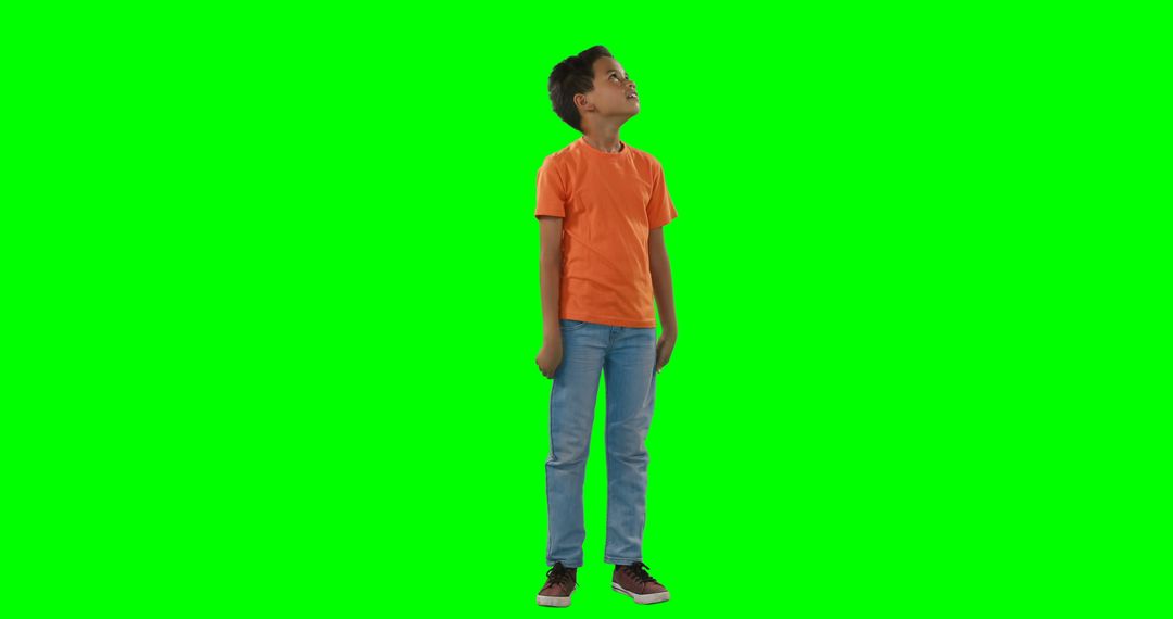 Curious Child Looking Up in Casual Outfit on Green Screen Background - Free Images, Stock Photos and Pictures on Pikwizard.com