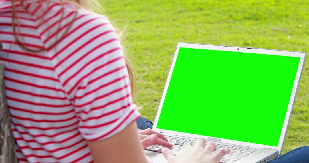 Woman Using Laptop Outdoors with Green Screen - Free Images, Stock Photos and Pictures on Pikwizard.com